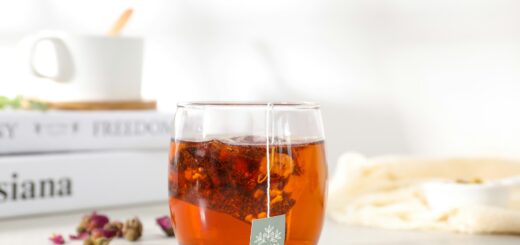 clear drinking glass with brown liquid
