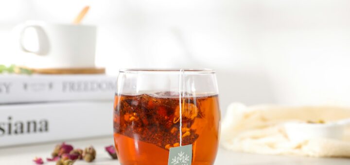 clear drinking glass with brown liquid