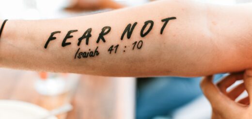 person with fear not tattoo on arm